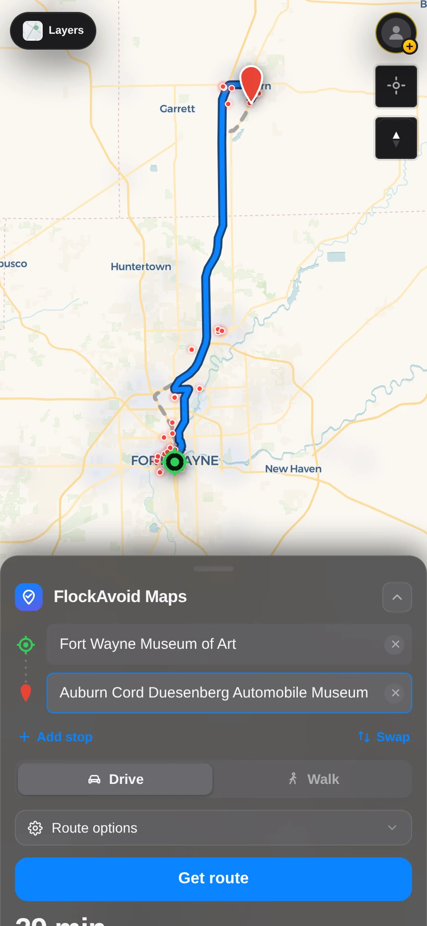 A FlockAvoid route on a phone: a blue driving route bending around red camera markers, with zero cameras on the route.